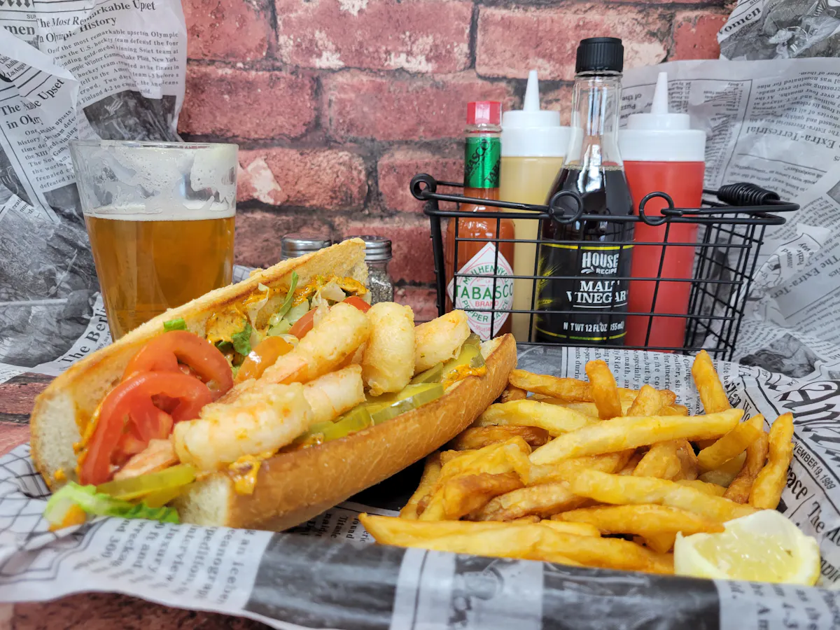 a sandwich sitting on top of a pile of fries